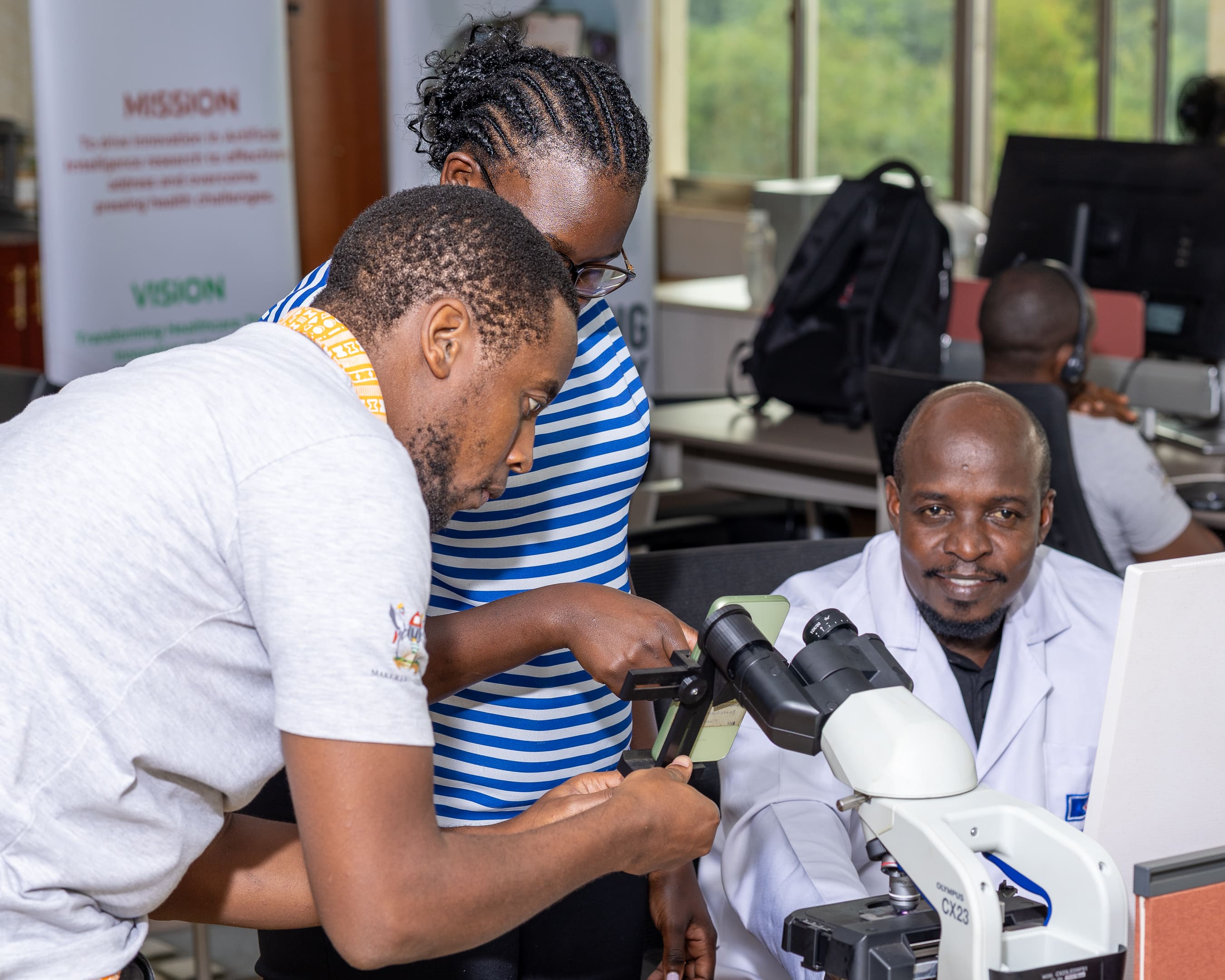 Members of the Makerere AI Health Lab team working together in the laboratory